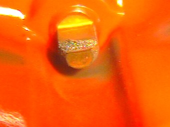 a broken ring of metal had been deposited inside the cap